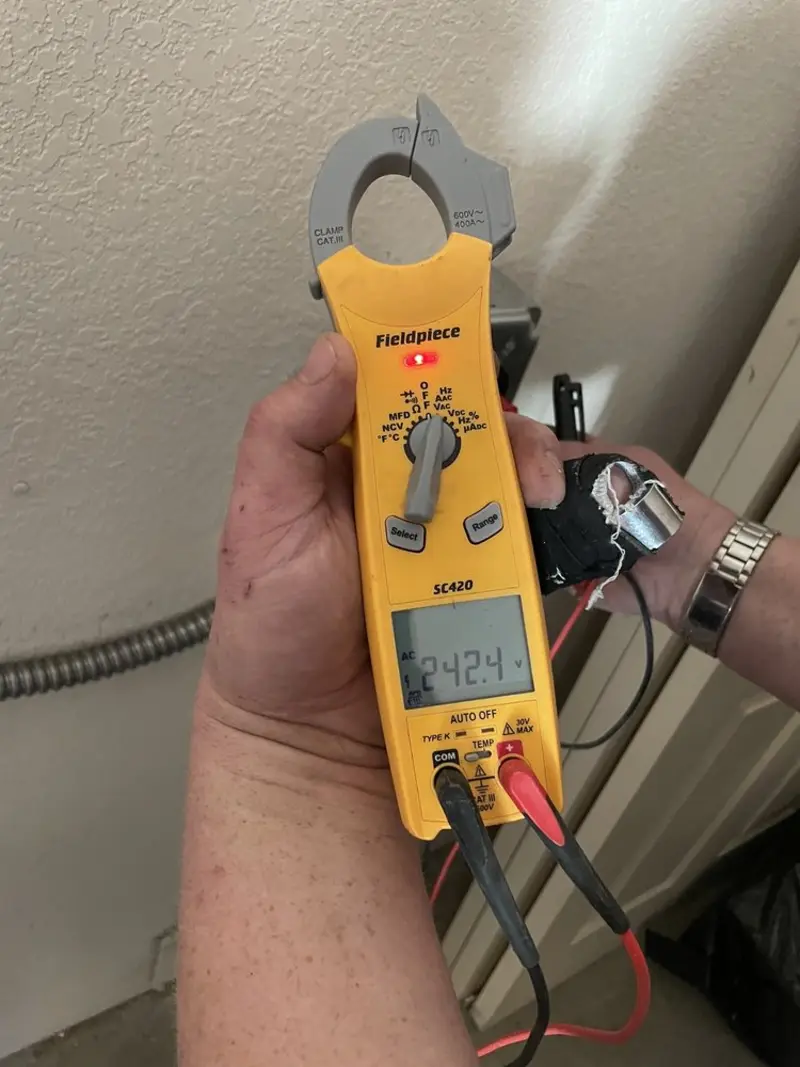 Voltage testing with clamp meter during Outlet Installation in Wakefield
